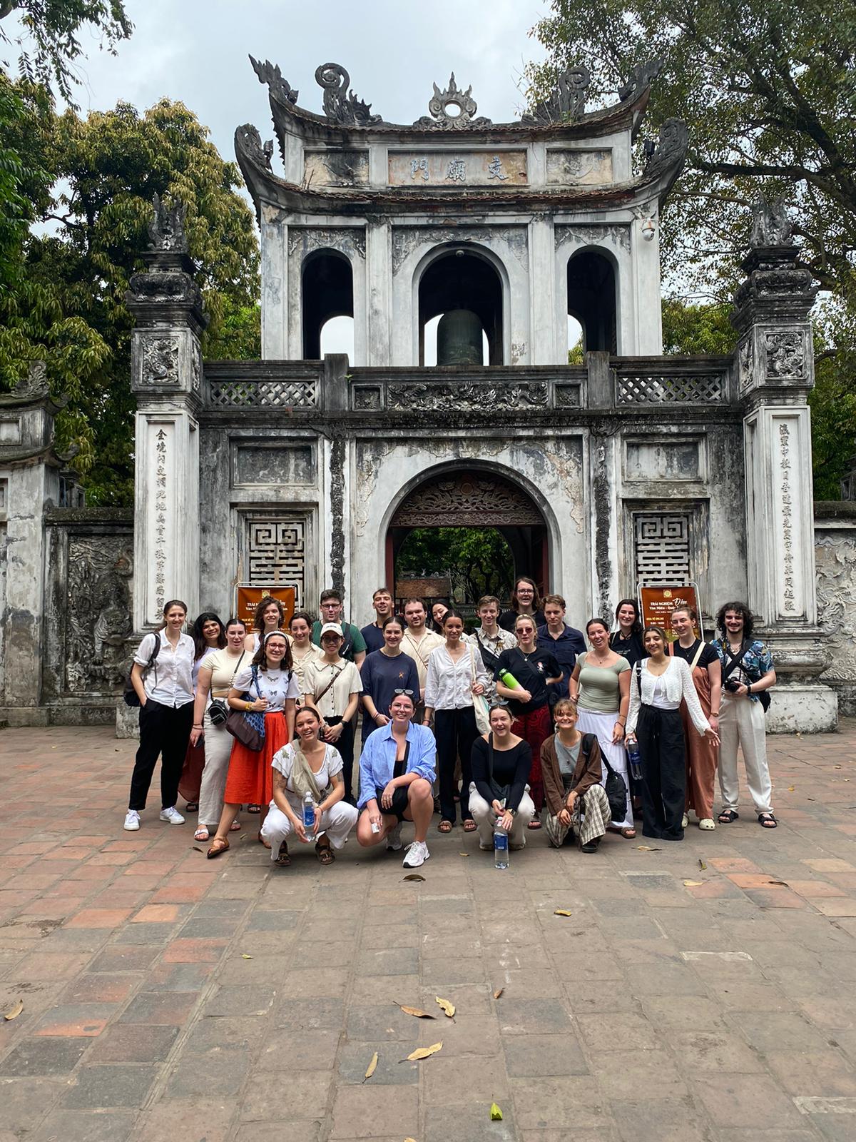 Cohort group shot at the Temple of Literature gateway, Hanoi